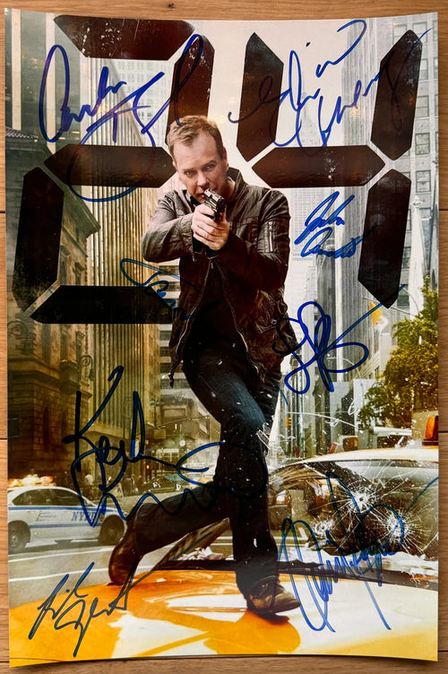 A cast autographed poster from the television series, 24. Signed photo of Kiefer Sutherland, Mary Lynn Rajskub, Carlos Bernard, Dennis Haysbert, Elisha Cuthbert, James Morrison, Reiko Aylesworth and Jude Ciccolella in blue ink marker signatures. Photograph autographs for sale on 8x12 inch picture.