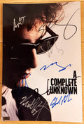 A cast autographed photo poster from the movie, A Complete Unknown. Signed photo of Timothee Chalamet, Edward Norton, Elle Fanning, Boyd Holbrook, Dan Fogler, Monica Barbaro, Norbert Leo Butz and Scoot McNairy in blue black and silver ink marker signatures. Photograph autographs for sale on 8x12 inch picture.