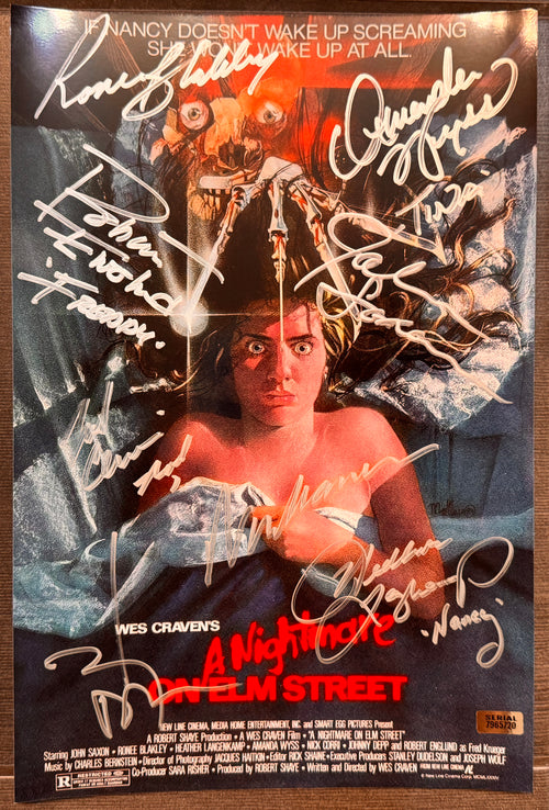 A cast autographed photo poster from the 1984 horror movie, A Nightmare on Elm Street. Signed photo of Robert Englund, Johnny Depp, Heather Langenkamp, ick Corri, Amanda Wydd, John Saxon, Ronee Blakley and Wes Craven in silver ink marker signatures. Photograph A Nightmare on Elm Street autographs for sale on 8x12 inch picture.