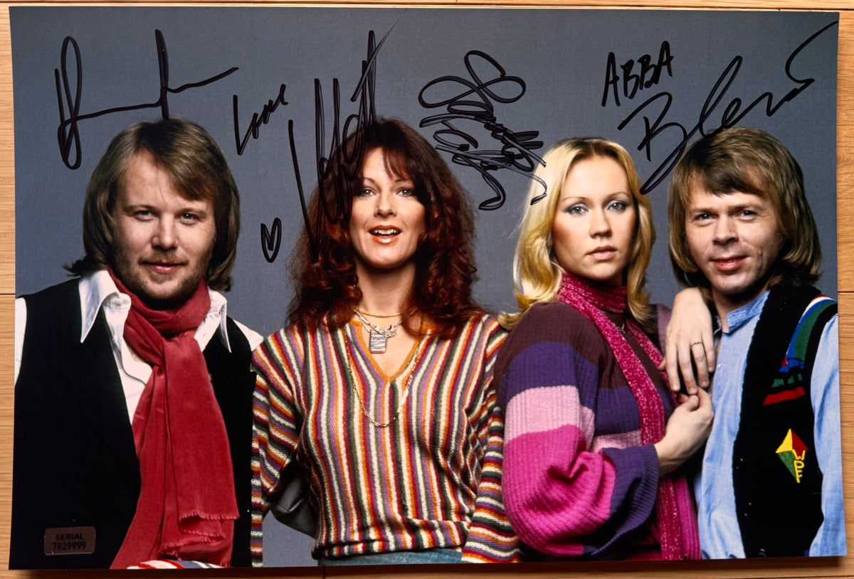 An autographed poster of the band, ABBA. Signed photo of Agnetha Faltskog, Bjorn Ulvaeus, Benny Andersson and Anni-Frid Lyngstad in black marker ink signatures. Photograph autographs for sale on 8x12 inch picture.