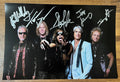 an autographed photo poster of the rock band Aerosmith. Signed photograph of Steven Tyler, Tom Hamilton, Joe Perry, Brad Whitford and Joey Kramer in silver ink marker signatures. Photograph Steven Tyler autographs for sale on picture.