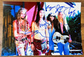 An autographed 8x12 photo print of the rock band Alice in Chains. Signed photo of Layne Staley, Jerry Cantrell, Mike Starr and Sean Kinney in blue ink marker signatures. Photograph autographs for sale on 8x12 inch picture.