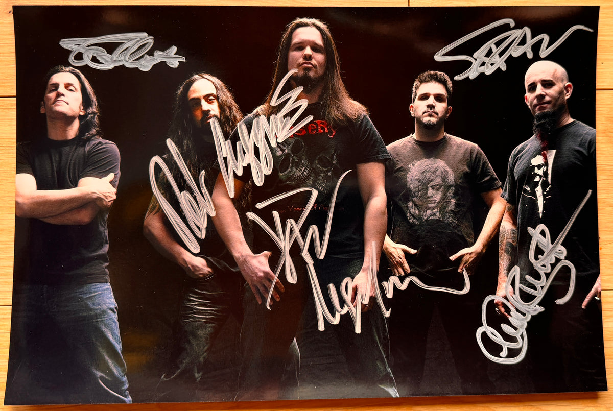An autographed photo poster of the heavy metal thrash band, Anthrax. Signed photo of Dan Nelson, Scott Ian, Rob Caggiano, Charlie Benante and Frank Bello in silver ink marker signatures. Photograph autographs for sale on 8x12 inch picture.