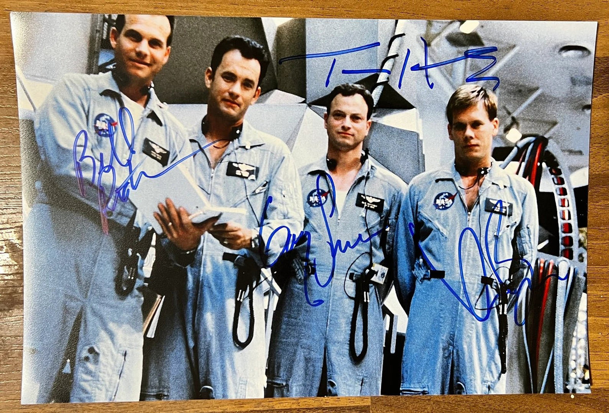 A cast autographed photo poster from the movie, Apollo 13. Signed photo of Tom Hanks, Bill Paxton, Kevin Bacon and Gary Sinise in blue ink marker signatures. Photograph autographs for sale on 8x12 inch picture.