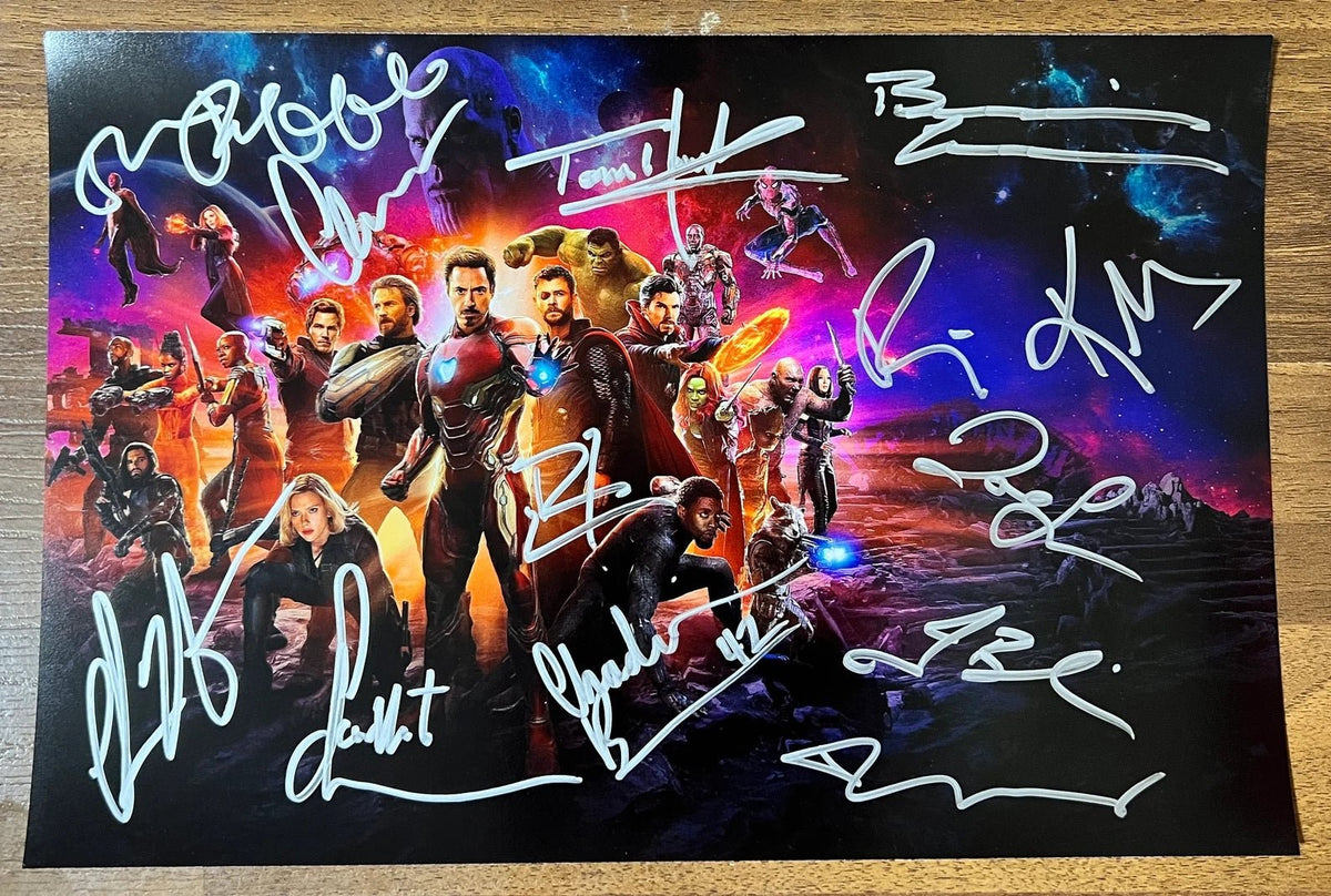 A cast autographed poster of Marvel's The Avengers Infinity War. Signed photo of Robert Downey Jr, Scarlett Johansson, Chris Hemsworth, Chris Evans, Mark Ruffalo, Benedict Cumberbatch, Karen Gillan, Zoe Saldana, Tom Holland, Chadwick Boseman, Josh Brolin, Don Cheadle and Tom Hiddleston in silver ink marker signatures. Photograph autographs for sale on 8x12 inch picture.