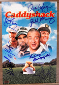 A cast autographed photo poster from the movie, Caddyshack. Signed photo of Bill Murray, Chevy Chase, Ted Knight, Rodney Dangerfield, Michael O'Keefe and Cindy Morgan in blue ink marker signatures. Photograph autographs for sale on an 8x12 inch picture.