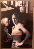 An autographed panini prizm rookie patch photo poster of WNBA Indiana Fever player, Caitlin Clark. Signed photograph in red paint pen ink marker signatures. Photograph Caitlin Clark autographs for sale on 8x12 inch picture.