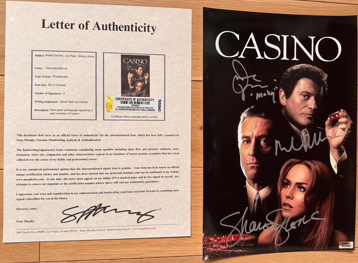 A signed Casino movie poster featuring the title 'CASINO'. Autographed photo by Robert De Niro, Joe Pesci (Added character name "Nicky"), and Sharon Stone in silver ink markers. photograph autographs for sale with 8x12 inch picture with COA.
