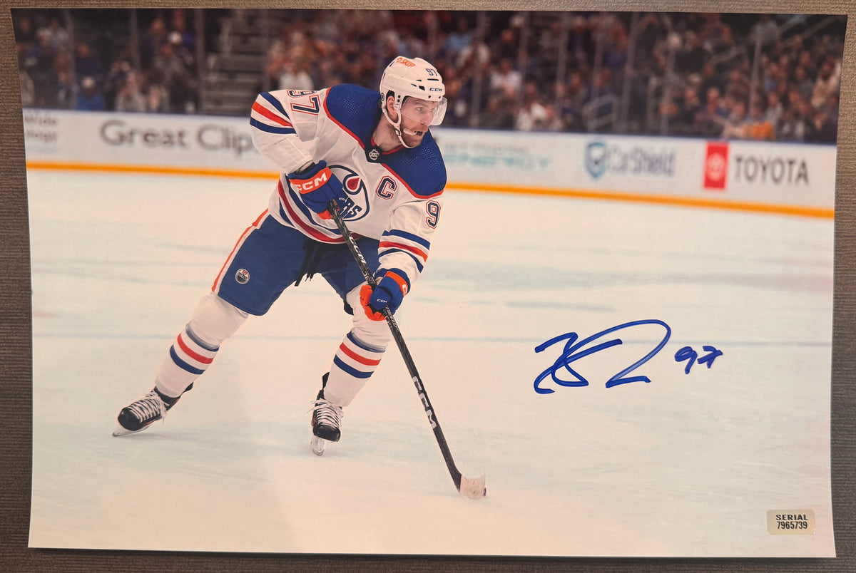 An autographed rookie auto photo poster of the NHL Edmonton Oilers hockey player, Connor McDavid. Signed photograph patch auto upper deck in blue ink marker signatures. Photograph Connor McDavid autographs for sale on 8x12 inch picture.