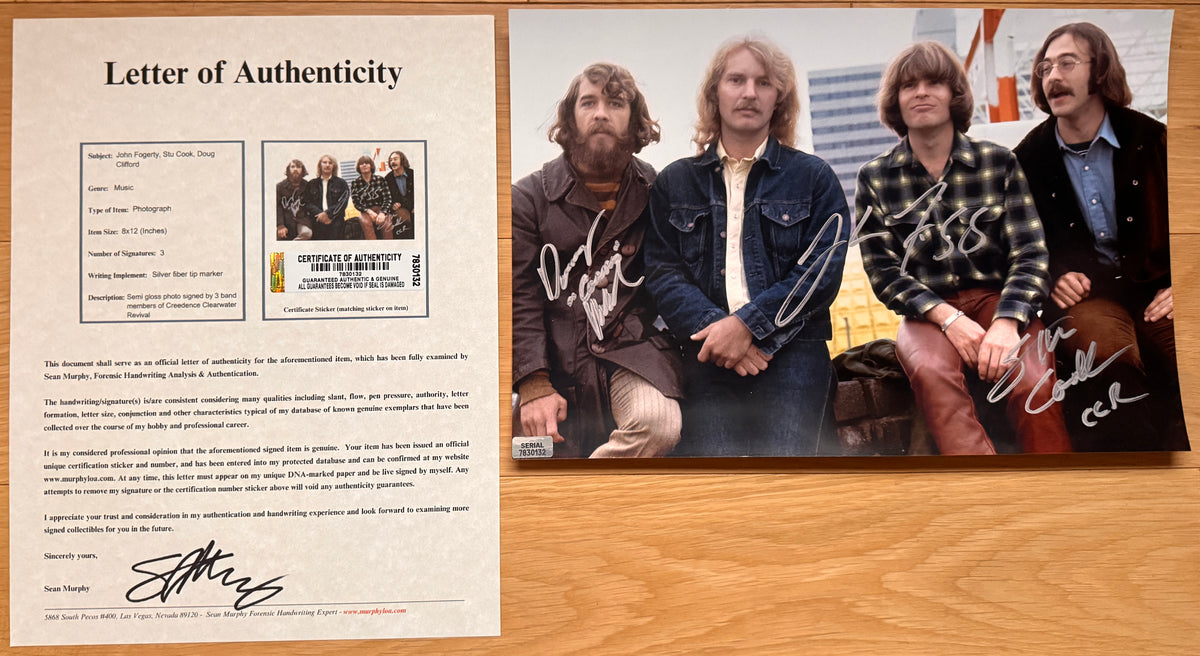 An autographed poster of the rock band Creedence Clearwater Revival also known as CCR. Signed photo of John Fogerty, Stu Cook and Doug Clifford in silver ink signatures. Photograph autographs for sale on 8x12 inch picture with COA