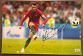 An autographed auto rookie rc patch auto photo poster of European Football soccer player, Cristiano Ronaldo. Signed photograph in black ink marker signatures. Photograph Cristiano Ronaldo autographs for sale on 8x12 inch picture.