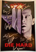 A cast autographed photo poster from the movie, Die Hard. Signed photo of Bruce Willis, Alan Rickman, Bonnie Bedelia, Reginald VelJohnson, Paul Gleason and William Atherton in silver ink marker signatures. Photograph Bruce Willis autographs for sale on 8x12 inch picture.