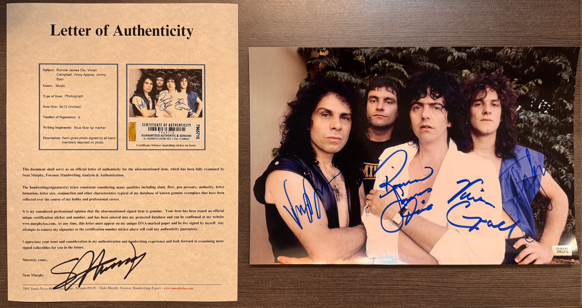 A band autographed photo poster of the rock band, Dio. Signed photo of Ronnie James Dio, Vivian Campbell, Vinny Appice and Jimmy Bain in blue ink marker signatures. Photograph Ronnie James Dio autographs for sale on 8x12 inch picture with COA.