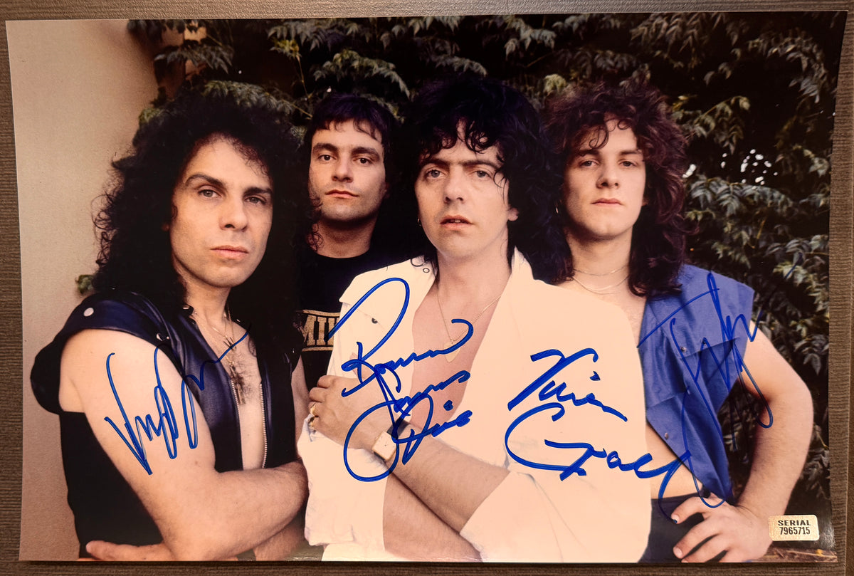 A band autographed photo poster of the rock band, Dio. Signed photo of Ronnie James Dio, Vivian Campbell, Vinny Appice and Jimmy Bain in blue ink marker signatures. Photograph Ronnie James Dio autographs for sale on 8x12 inch picture.
