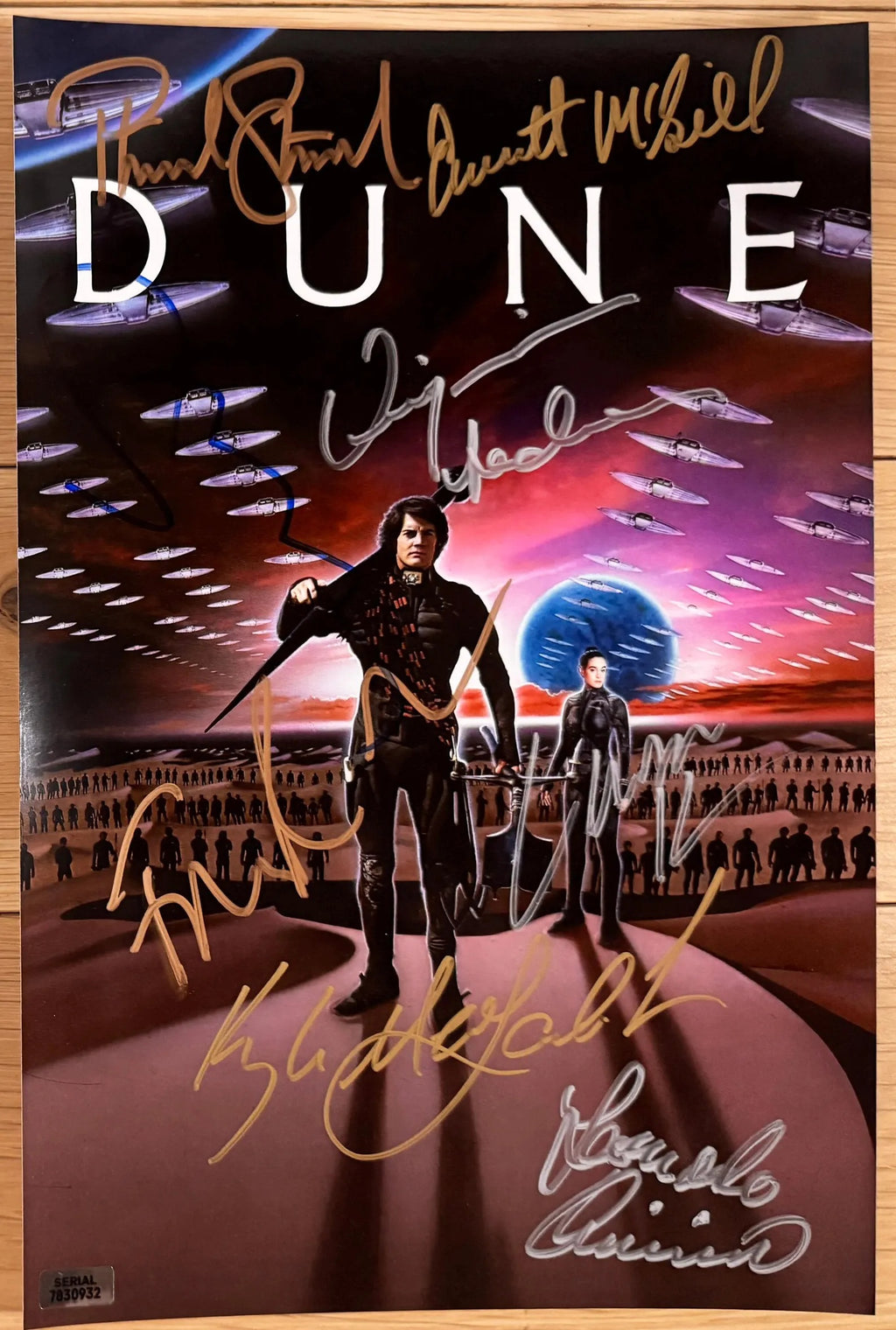 A cast autographed poster of the 1984 movie, Dune. Signed photo of Kyle MacLachlan, Virginia Madsen, Francesca Annis, Leonardo Cimino, Everett McGill, Linda Hunt, Patrick Stewart, Sting in silver and gold ink marker signatures. Photograph autographs for sale on 8x12 inch picture.