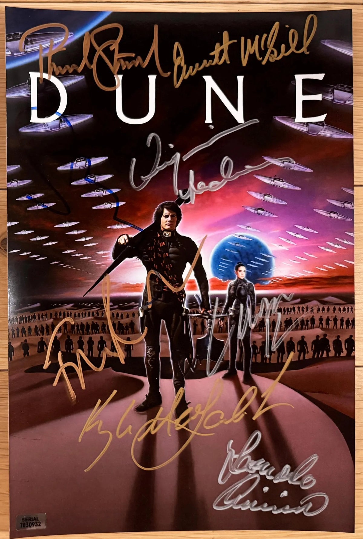 A cast autographed poster of the 1984 movie, Dune. Signed photo of Kyle MacLachlan, Virginia Madsen, Francesca Annis, Leonardo Cimino, Everett McGill, Linda Hunt, Patrick Stewart, Sting in silver and gold ink marker signatures. Photograph autographs for sale on 8x12 inch picture.