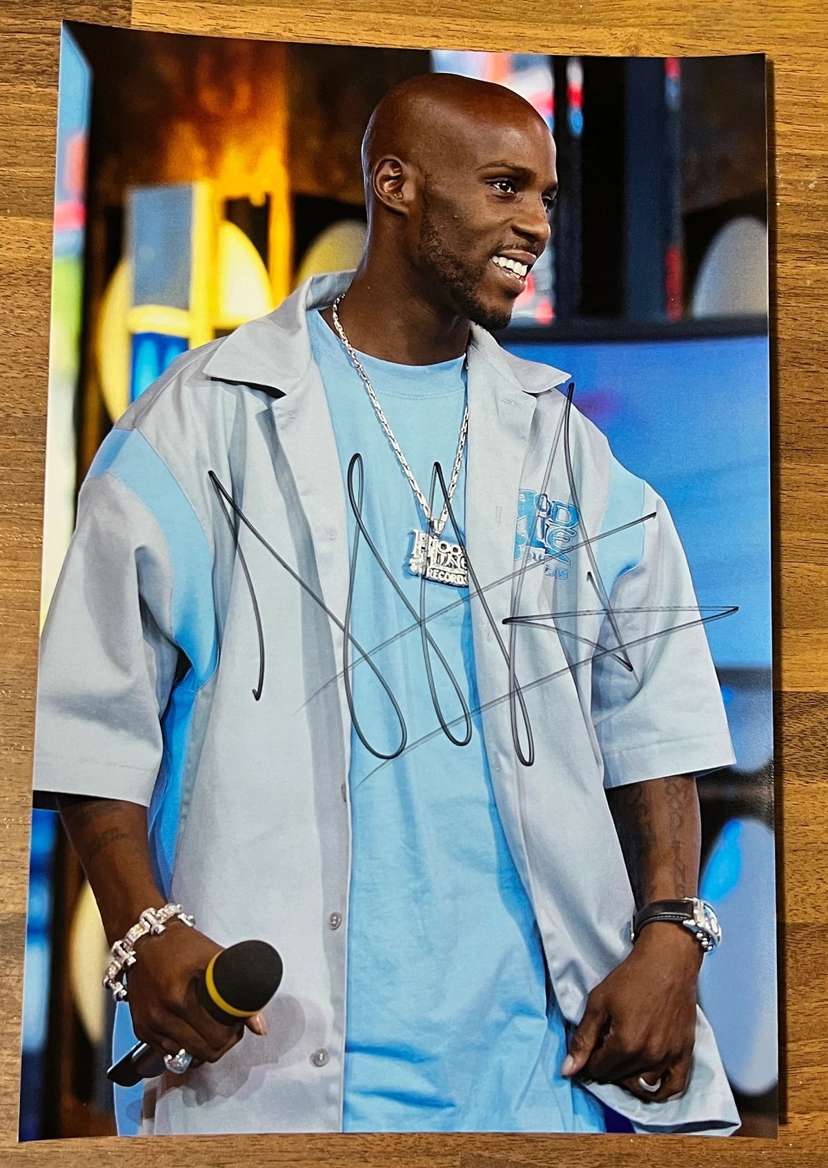 an autographed photo of hip hop rapper, DMX. Signed poster in black marker on an 8x12 inch photograph. Big autograph. Photograph autographs for sale on 8x12 inch picture.