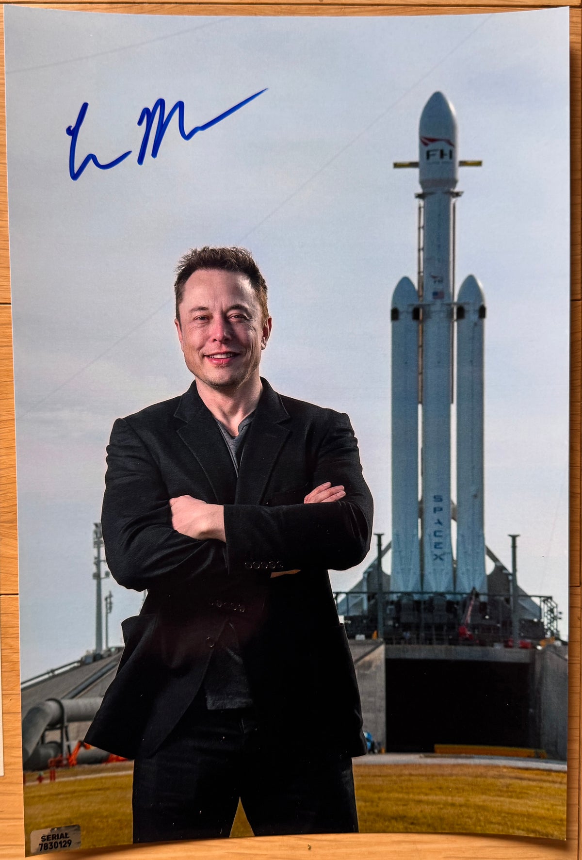 An autographed poster of Tesla and SpaceX CEO and Founder, Elon Musk. Signed photo in blue ink marker signatures. Photograph Elon Musk autographs for sale on 8x12 inch picture.