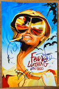 A cast autographed photo of the movie, Fear and Loathing in Las Vegas. Signed poster of Johnny Depp, Benicio Del Toro and Hunter S. Thompson in blue ink marker signatures. Photograph autographs for sale on 8x12 inch picture.