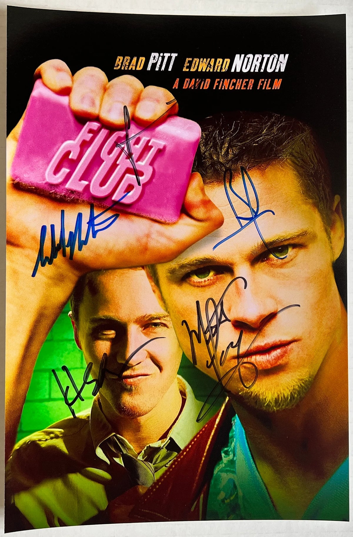 A cast autographed 8x12 movie poster for the film 'Fight Club'. Signed photo of Brad Pitt, Edward Norton, Jared Leto, Meat Loaf and Helena Bonham Carter in blue and black ink marker signatures. Photograph autographs for sale on 8x12 inch picture.