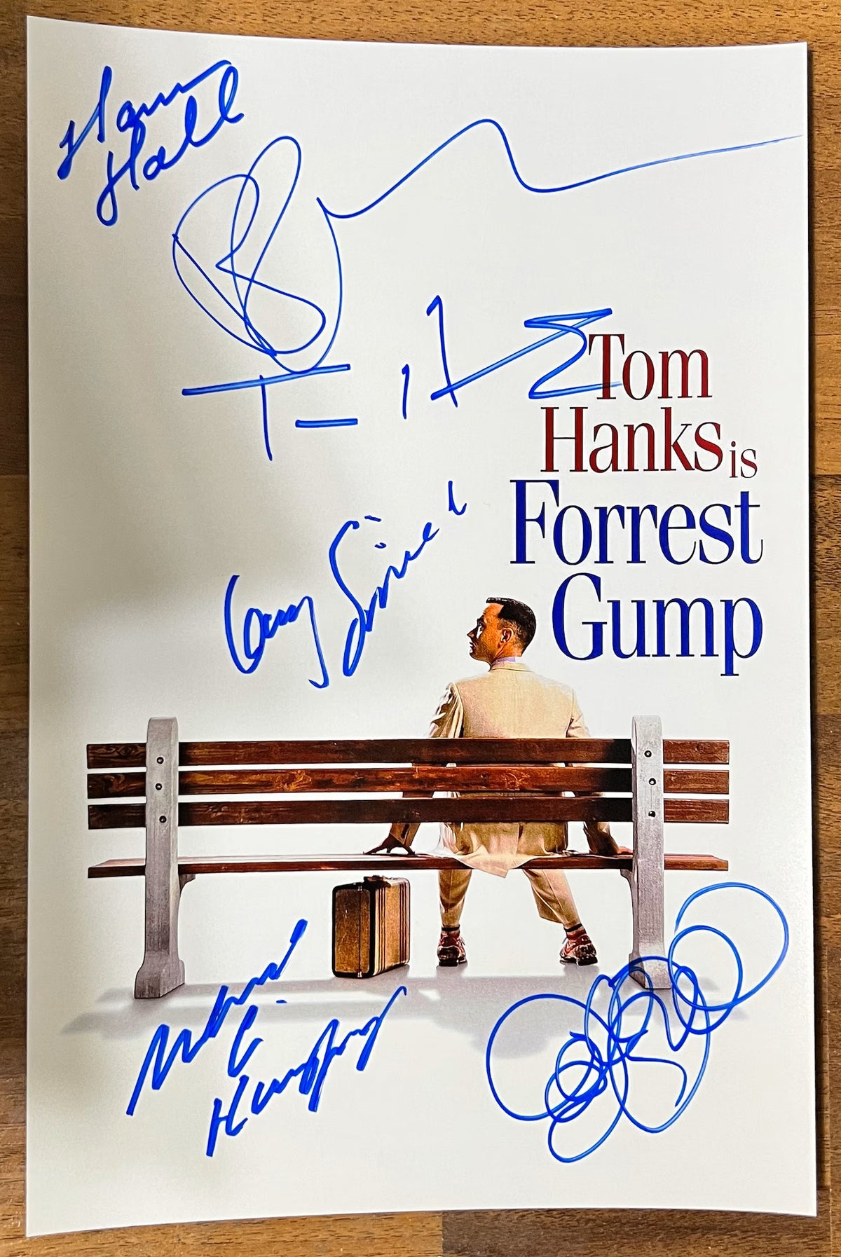 A cast autographed photo poster for the movie, Forrest Gump. Signed photo of Tom Hanks, Robin Wright, Gary Sinese, Hanna Hall, Michael Conner Humphreys and Sally Field in blue ink marker signatures. photograph Forrest Gump autographs for sale on 8x12 inch picture.