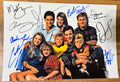 An autographed photo of the television sitcom Full House. signed photograph of Mary-Kate Olsen, Ashley Olsen, Bob Saget, Dave Coulier, John Stamos, Candace Cameron Bure, Jodie Sweetin, Lori Loughlin and Andrea Barber in blue and black ink marker signatures. Photograph autographs Full House autographs for sale on picture.