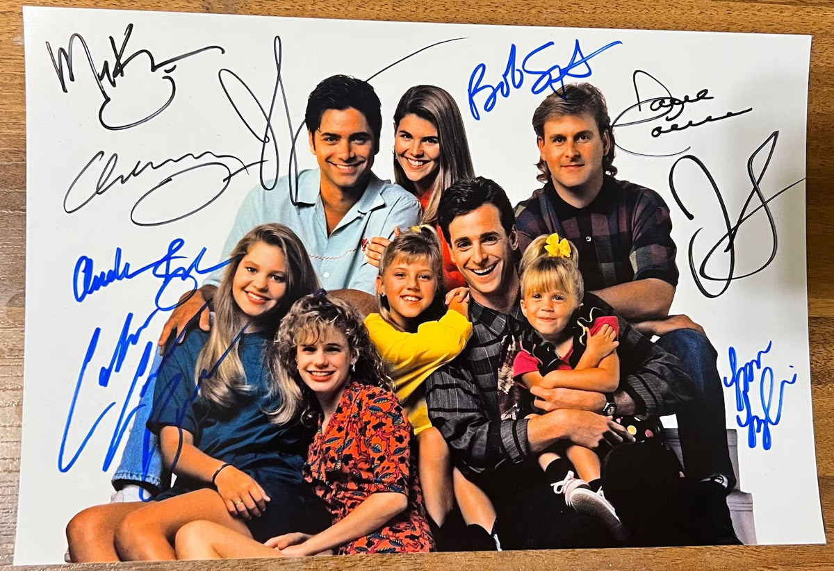 An autographed photo of the television sitcom Full House. signed photograph of Mary-Kate Olsen, Ashley Olsen, Bob Saget, Dave Coulier, John Stamos, Candace Cameron Bure, Jodie Sweetin, Lori Loughlin and Andrea Barber in blue and black ink marker signatures. Photograph autographs Full House autographs for sale on picture.