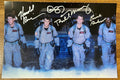 A cast autographed photo poster of the movie, Ghostbusters. Signed photograph of Bill Murray, Dan Aykroyd, Harold Ramis and Ernie Hudson in silver ink signatures. Photograph Ghostbusters autographs for sale on picture.