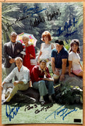 A cast autographed poster from the television series Gilligans Island or Gilligan's Island. Signed photo of Bob Denver, Alan Hale Jr., Jim Backus, Natalie Schafer, Tina Louise, Russell Johnson and Dawn Wells in blue and black ink marker signatures. Photograph autographs for sale on 8x12 inch picture.