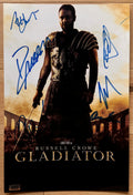 A cast autographed movie poster of the movie, Gladiator. Signed photo of Russell Crowe, Joaquin Phoenix, Connie Nielsen, Oliver Reed, Richard Harris and Djimon Hounsou in blue ink marker signatures. photograph autographs for sale on 8x12 inch picture.