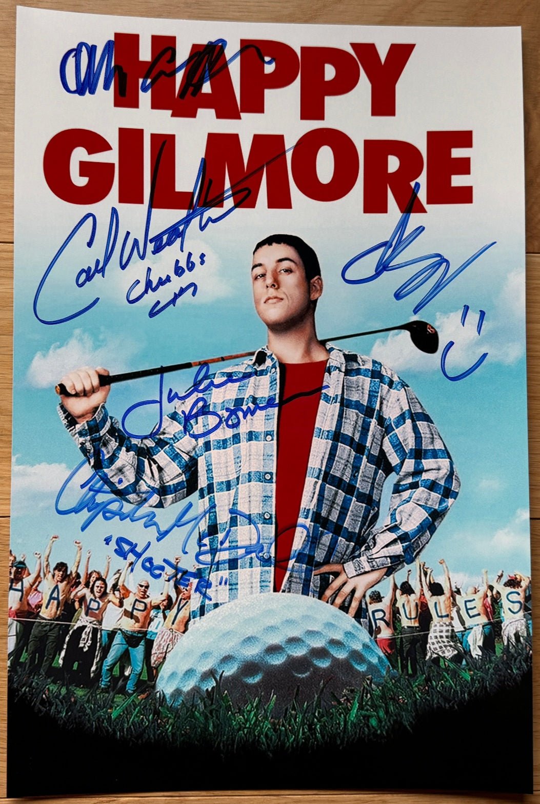 A cast autographed movie poster for the film 'Happy Gilmore. Signed photo of Adam Sandler, Carl Weathers, Christopher McDonald, Allen Covert and Julie Bowen. Photograph autographs for sale on 8x12 inch picture.