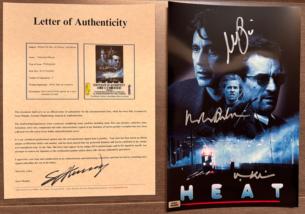 An autographed 8x10 movie poster for the film 'Heat' featuring signatures from al pacino, robert de niro and val kilmer. autograph in silver ink on an 8x12 inch photograph with COA.