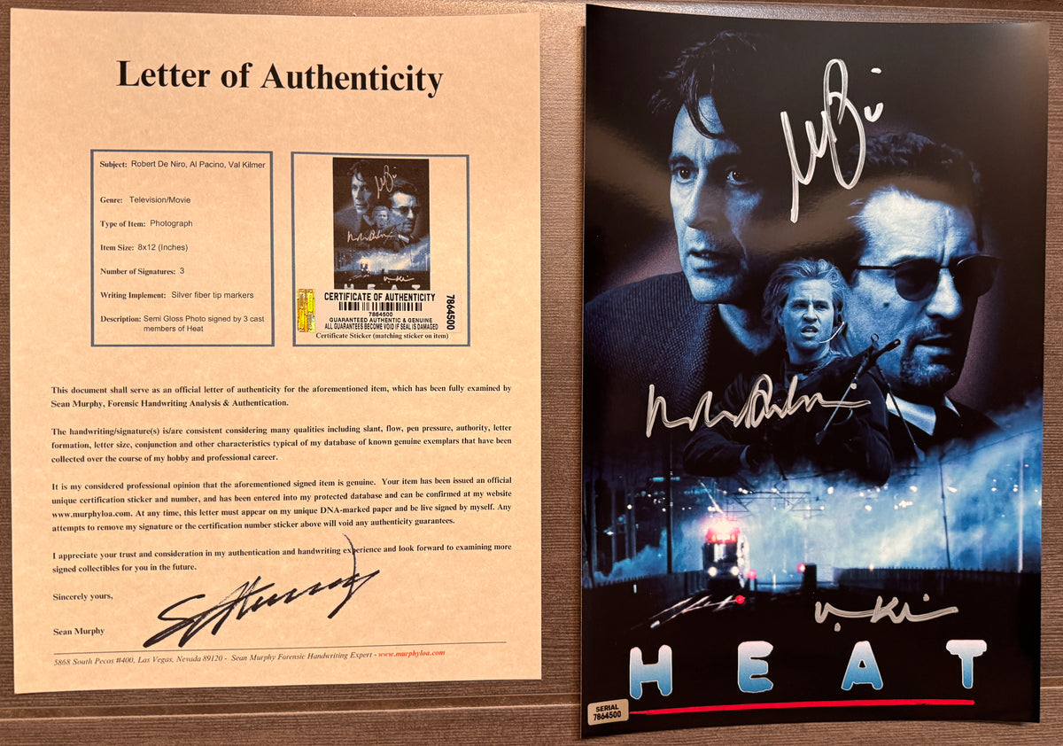 An autographed 8x10 movie poster for the film 'Heat' featuring signatures from al pacino, robert de niro and val kilmer. autograph in silver ink on an 8x12 inch photograph with COA.