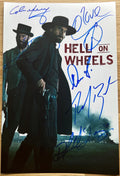 A cast autographed poster of the television series, Hell on Wheel. Signed photo of Anson Mount, Common, Colm Meaney, Robin McLeavy, Phil Burke and Christopher Heyerdahl in blue ink marker signatures. Photograph autographs for sale on 8x12 inch picture.