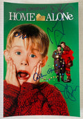 A cast autographed poster of Christmas Movie Home Alone. Signed photo of Macaulay Culkin, Joe Pesci, Daniel Stern, John Heard, Catherine O'Hara and Devin Ratray in blue ink marker signatures. Photograph Home Alone autographs for sale on 8x12 inch picture.