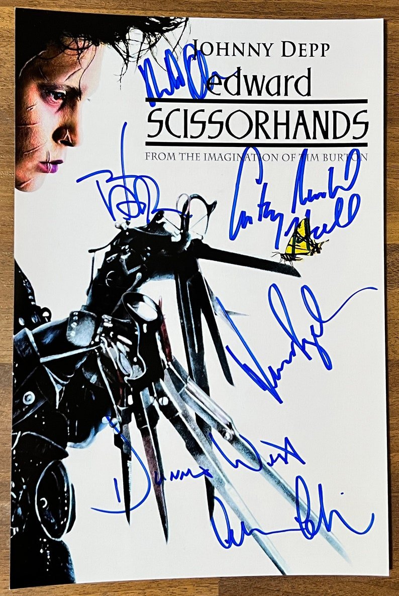 A cast autographed poster of the movie, Edward Scissorhands. Signed photo of Johnny Depp, Winona Ryder, Anthony Michael Hall, Alan Arkin, Dianne Wiest and Robert Oliveri in blue ink marker signatures. Photograph autographs for sale on 8x12 inch picture.
