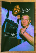 A dual autographed poster of rappers Eminem and Dr. Dre. Signed photo in silver ink marker signatures. Comprable to an album, cd, or LP. Photograph autographs for sale on 8x12 inch picture.