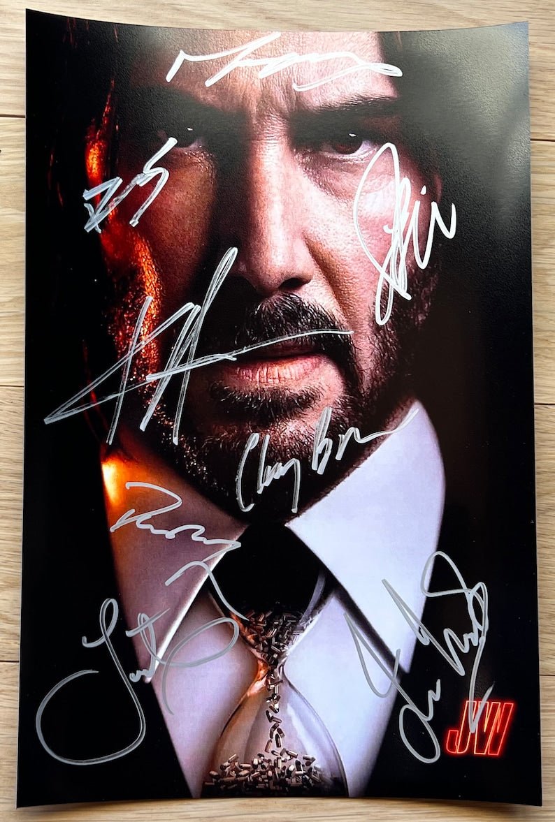 A cast autographed poster of the movie, John Wick. Signed photo of Keanu Reeves, Laurence Fishburne, Lance Reddick, Clancy Brown, Ian McShane, Bill Skarsgard, Donnie Yen and Hiroyuki Sanada in silver ink marker signatures. Photograph autographs for sale on 8x12 inch picture.