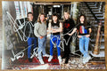 An autographed poster of the heavy metal band, Iron Maiden. Signed photo of Bruce Dickinson, Steve Harris, Adrian Smith, Dave Murray and Nicko McBrain in silver ink marker signatures. Photograph autographs for sale on 8x12 inch picture.