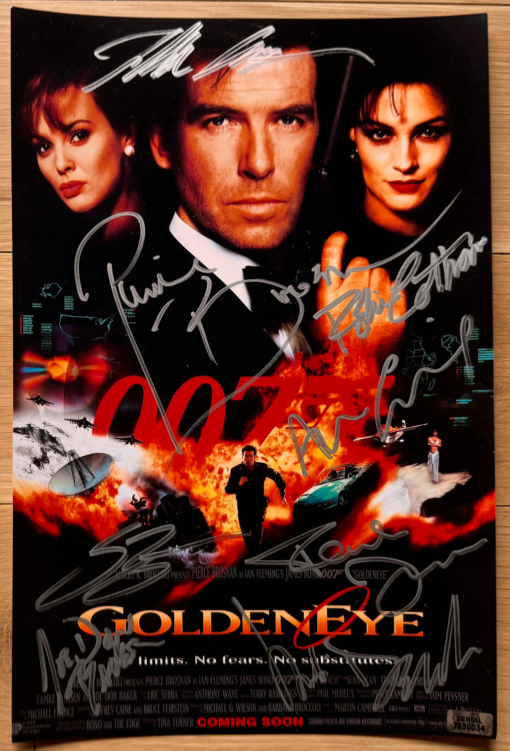 A cast autographed poster from the James Bond movie, 007 Goldeneye. Signed photo of Pierce Brosnan, Sean Bean, Izabella Scorupco, Famke Janssen, Joe Don Baker, Judi Dench, Robbie Coltrane and Alan Cumming in silver ink marker signatures. Photographs goldeneye autographs for sale on 8x12 inch picture.