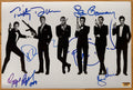 A cast autographed poster of all the actors who have played James Bond in the movies. Signed photo of Sean Connery, Pierce Brosnan, George Lazenby, Daniel Craig, Timothy Dalton and Roger Moore in blue ink marker signatures. Photograph autographs for sale on 8x12 inch picture.