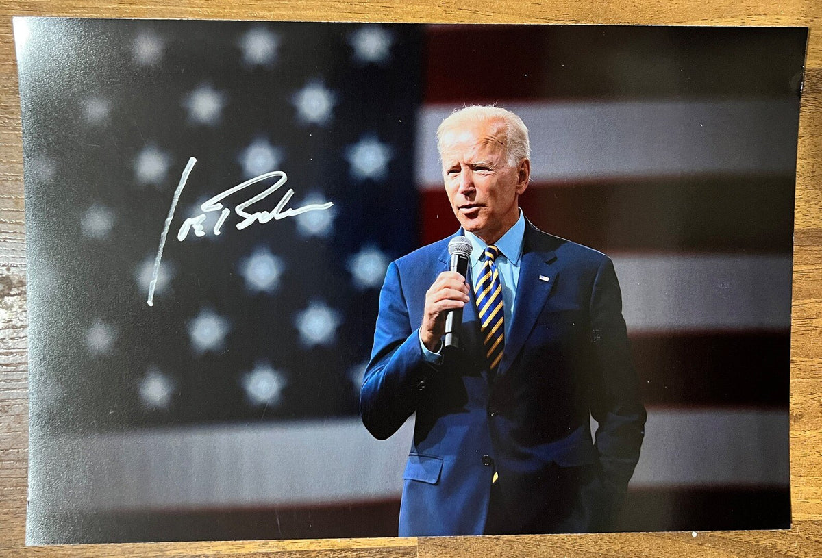 An autographed photo poster of President of the United States, Joe Biden. Signed photo in silver ink marker signatures. Photograph Joe Biden autographs for sale on picture.