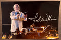 An autographed photo poster of star wars music composer, John Williams. Signed photo in silver ink marker signatures. Photograph John Williams autographs for sale on 8x12 inch picture.