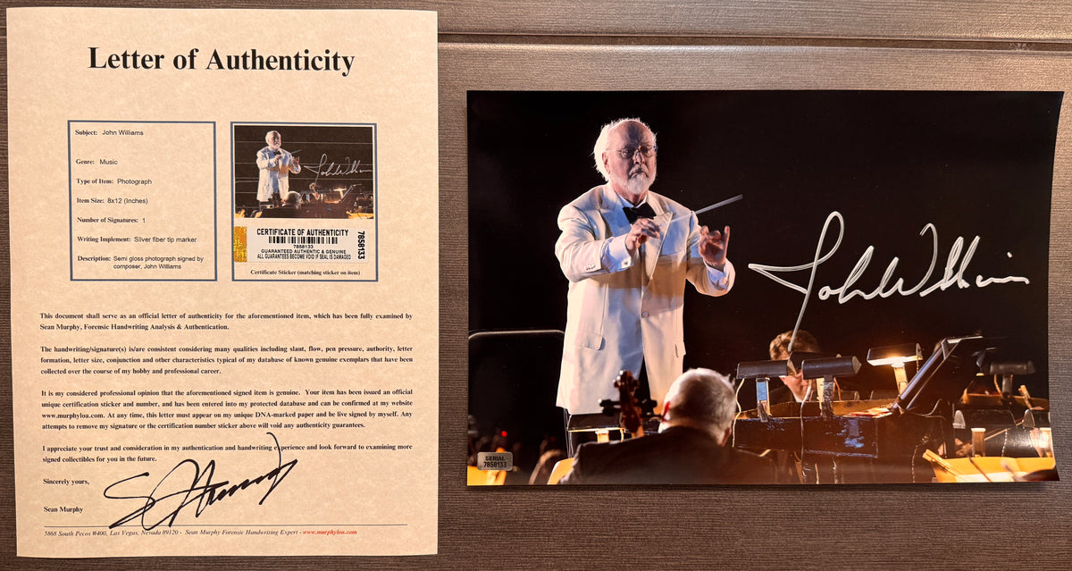 An autographed photo poster of star wars music composer, John Williams. Signed photo in silver ink marker signatures. Photograph John Williams autographs for sale on 8x12 inch picture with COA.
