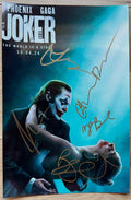 A cast autographed photo of the movie, Joker Folie a Deux. Signed poster of Joaquin Phoenix, Lady gaga, Zazie Beetz, Catherin Keener and Brendan Gleeson in gold ink marker signatures. Photograph autographs for sale on 8x12 inch picture.