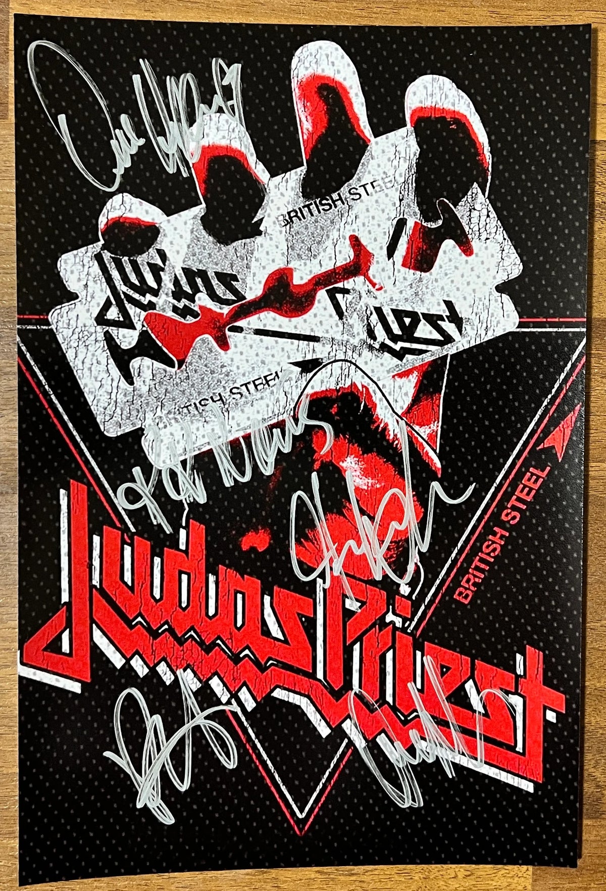 An autographed photo poster of the heavy metal band, Judas Priest. Signed photo of Rob Halford, Dave Holland, K.K. Downing, Glenn Tipton and Ian Hill in silver ink marker signatures. Photograph Judas Priest autographs for sale on 8x12 inch picture.