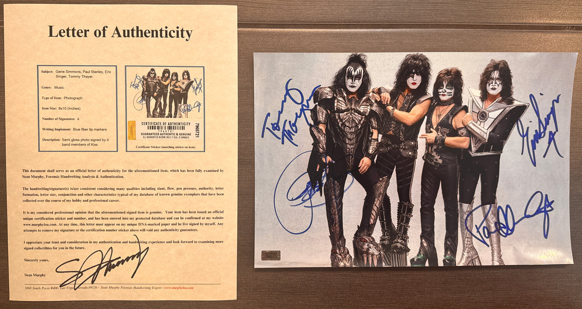 A complete autographed photo poster of the rock n roll band, KISS. Signed photo of Gene Simmons, Paul Stanley, Eric Singer and Tommy Thayer in blue ink marker signatures. Photograph KISS autographs for sale on 8x12 inch picture with COA.