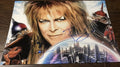 A cast autographed photo poster from the movie, Labyrinth. Signed photo of David Bowie and Jennifer Connelly in blue ink marker signatures. Photograph autographs for sale on 8x12 inch picture.