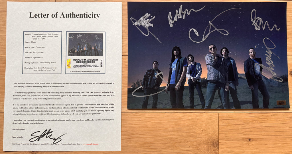 An autographed poster of the band Linkin Park. signed photo by Chester Bennington, Rob Bourdon, Brad Delson, Mike Shinoda, Dave Farrell and Joe Hahn in silver ink marker. photograph autographs for sale. 8x12 inch picture with COA.