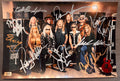 An autographed photo poster of the band,  Lynyrd Skynyrd. signed photo of Johnny Van Zant, Rickey Medlocke, Michael Cartellone, Mark Matejka, Peter Keys, Damon Johnson, Keith Christopher, Carol Chase and Stacey Michelle in silver and gold ink marker signatures. photograph lynyrd skynyrd autographs for sale on 8x12 inch picture.